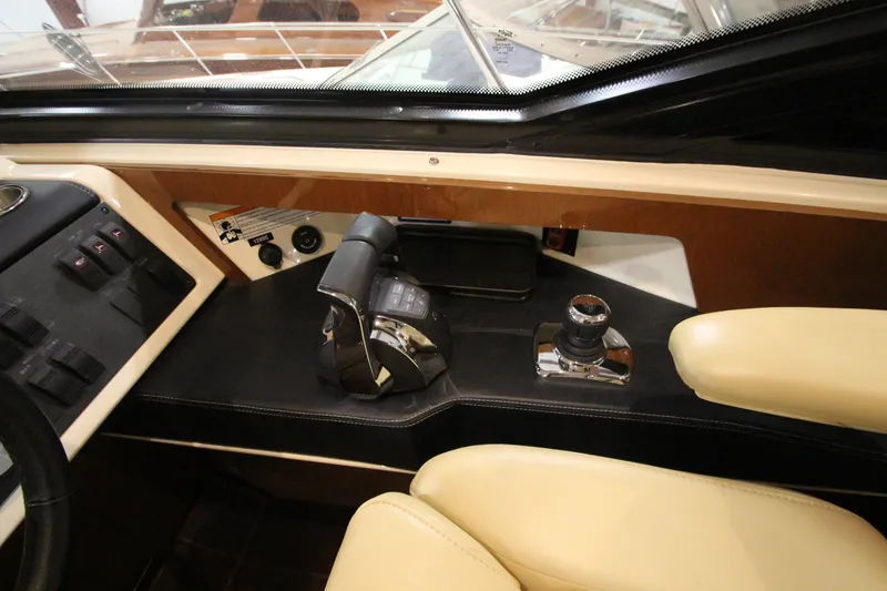 Slide: The Image of Helm controls of 2016 Sea Ray 510 Sundancer yacht with leather seating. - 43
