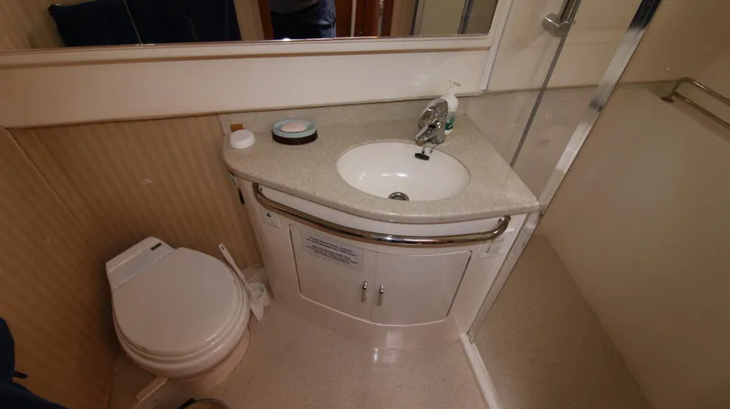 Slide: The Image of 2007 Cabo 40 Hardtop Express bathroom with sink, toilet, and shower. - 29