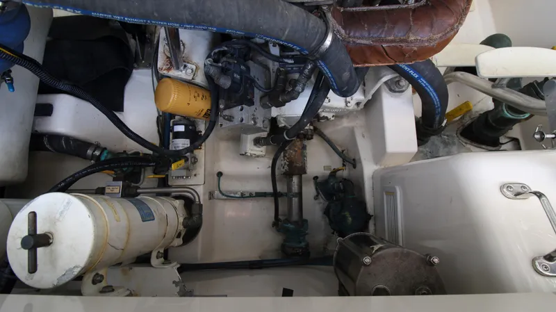 Slide: The Image of Engine compartment of 2007 Cabo 40 Hardtop Express boat, showcasing mechanical components. - 30