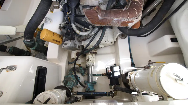 Slide: The Image of Engine compartment of a 2007 Cabo 40 Hardtop Express boat, showcasing mechanical components. - 34