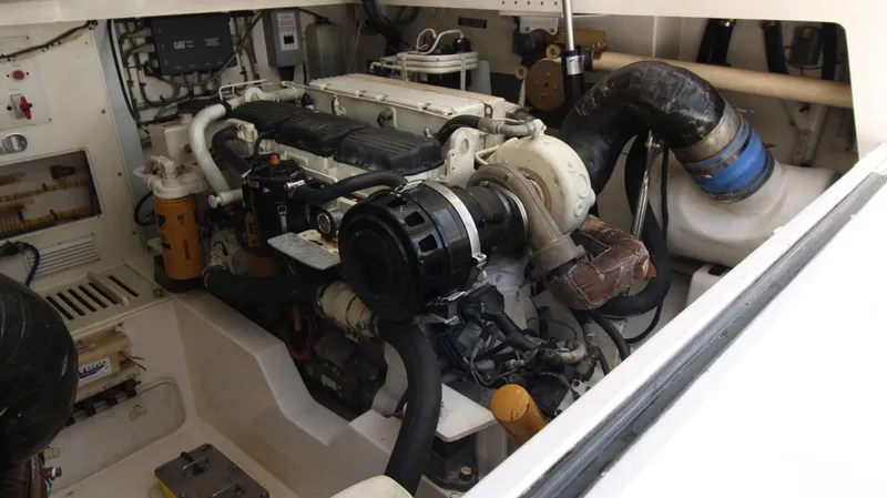 Slide: The Image of Engine room of a 2007 Cabo 40 Hardtop Express boat, showcasing mechanical components. - 35