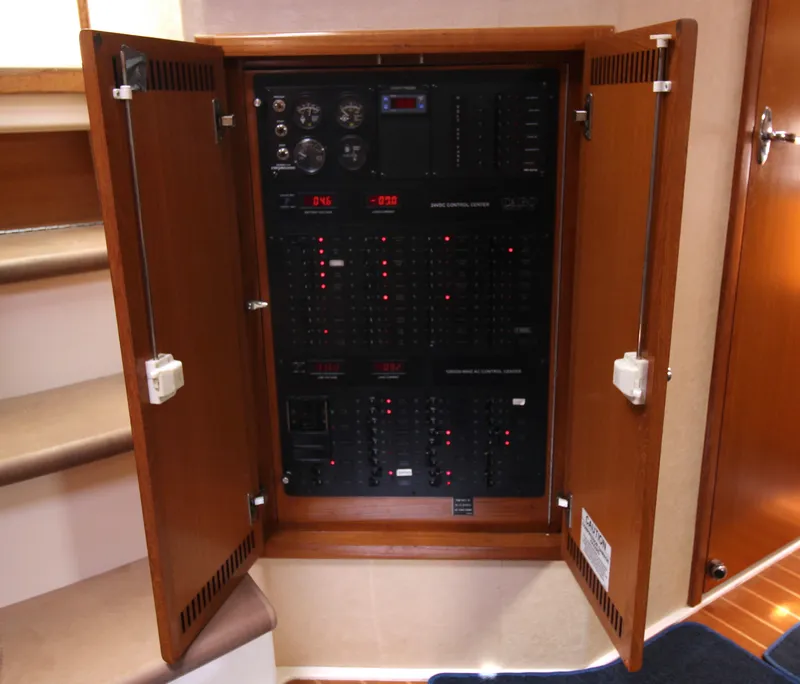 Slide: The Image of Electrical control panel inside a 2007 Cabo 40 Hardtop Express yacht. - 36