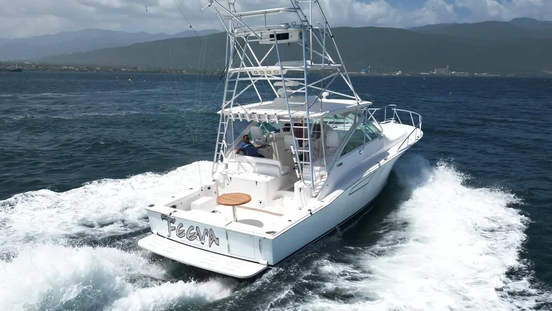 Slide: The Image of 2007 Cabo 40 Hardtop Express cruising on open water, showcasing sleek design and powerful performance. - 4