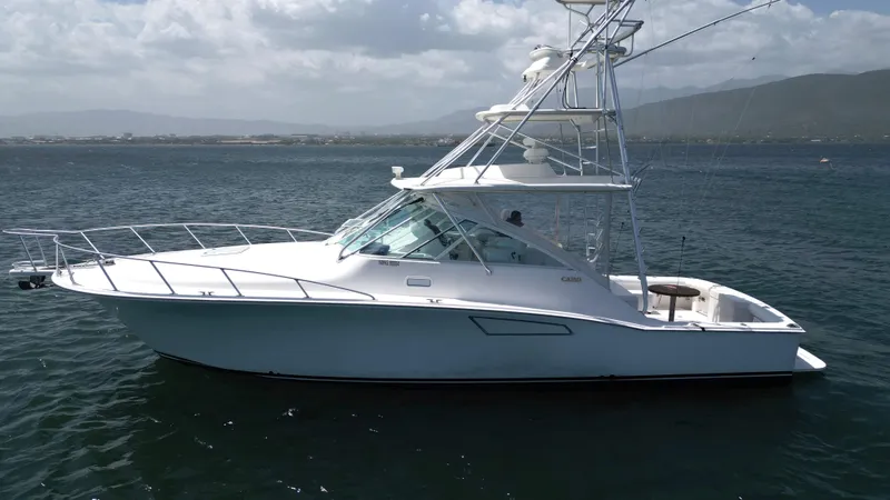 Slide: The Image of 2007 Cabo 40 Hardtop Express yacht on calm waters, side view. - 8