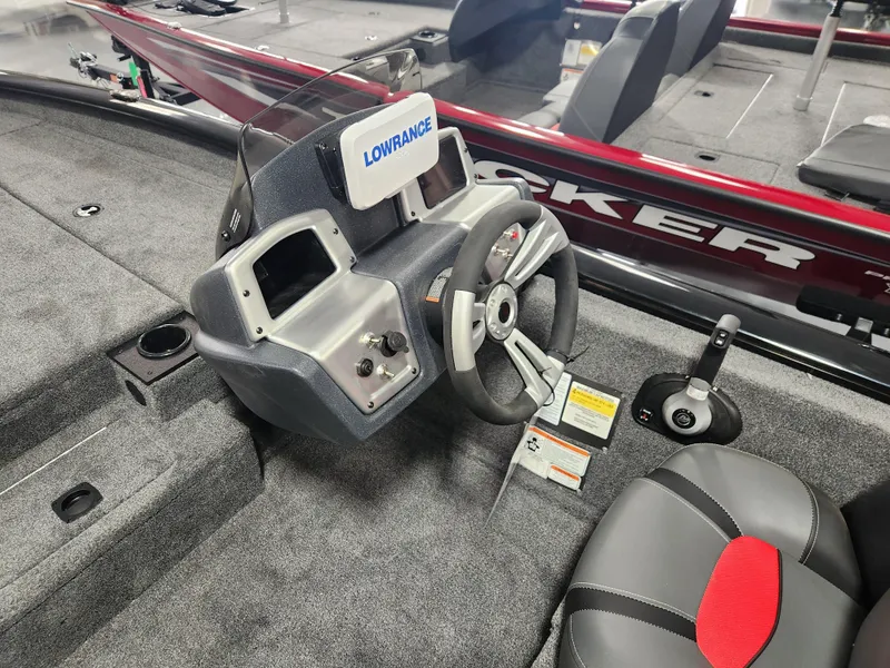 Slide: The Image of 2025 Tracker Pro Team 190 boat interior with steering wheel and Lowrance display. - 10