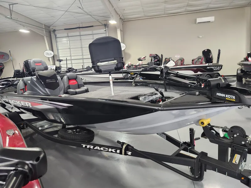 Slide: The Image of 2025 Tracker Pro Team 190 boat in showroom, featuring sleek design and modern equipment. - 5