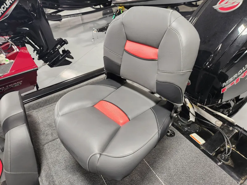 Slide: The Image of 2025 Tracker Pro Team 190 boat seat with gray and red upholstery. - 7
