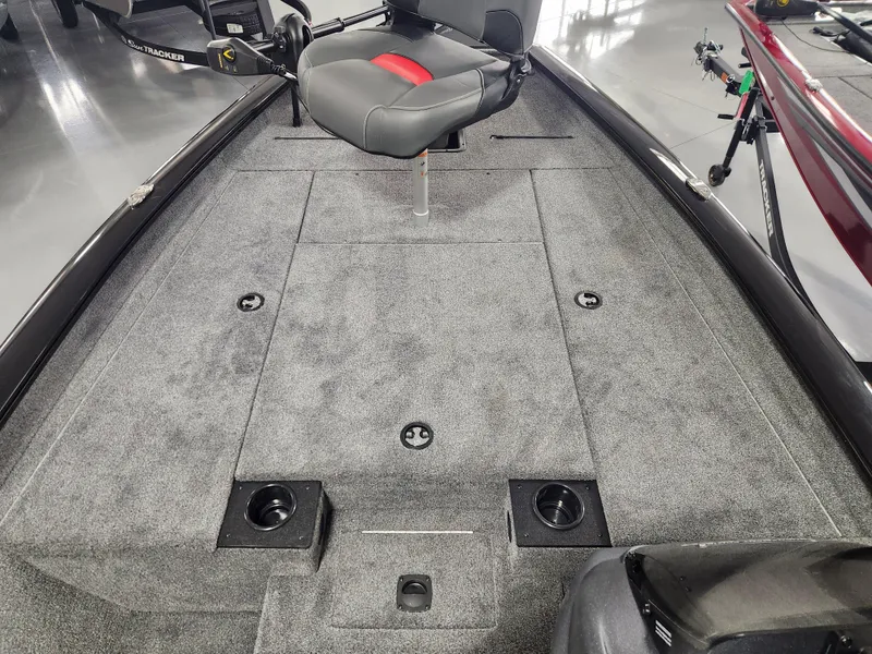Slide: The Image of 2025 Tracker Pro Team 190 boat interior with gray carpet and seating. - 8