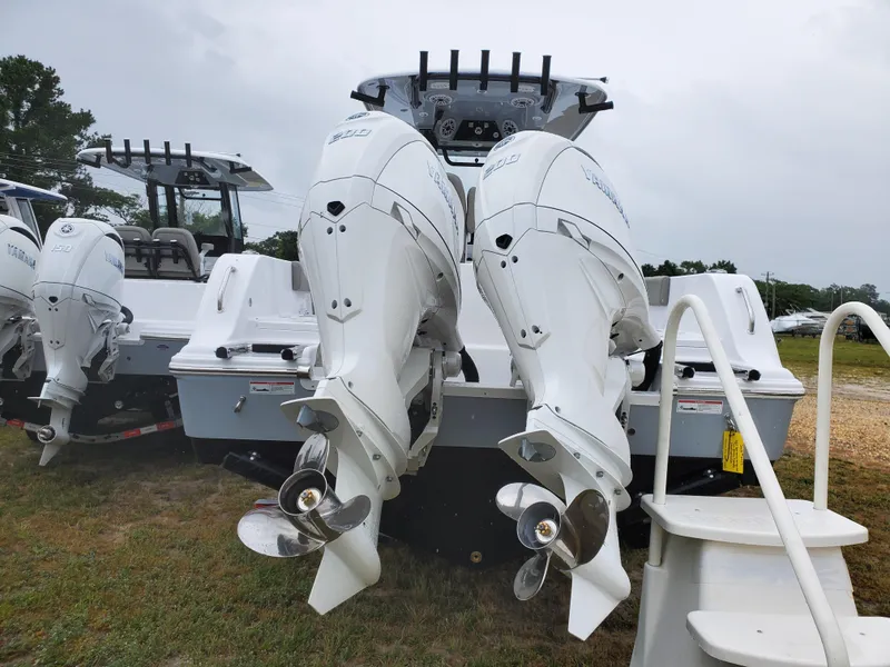 Slide: The Image of 2025 Sportsman Heritage 261 Center Console with dual outboard engines, rear view. - 3