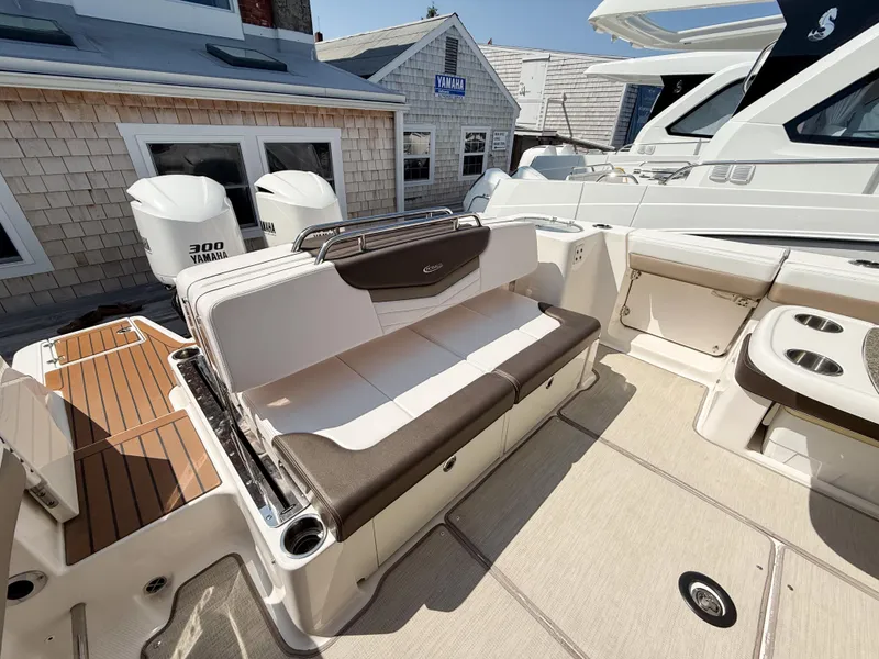 Slide: The Image of 2020 Robalo R317 Dual Console boat interior with seating and Yamaha engines. - 17