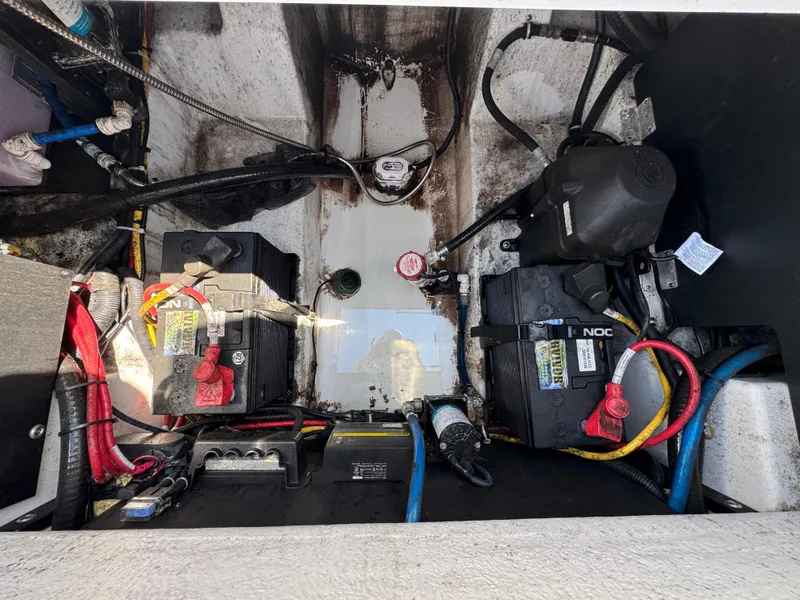 Slide: The Image of 2020 Blackfin 212 CC boat battery compartment with wiring and components. - 11
