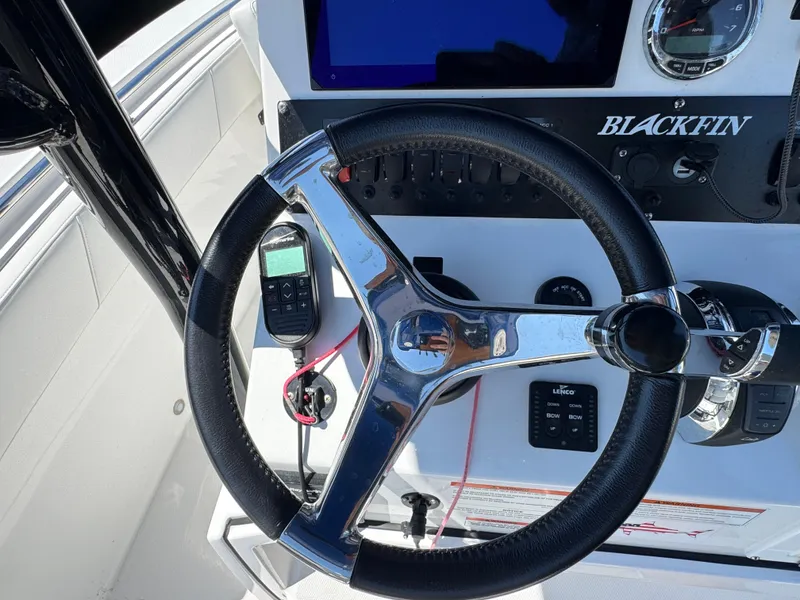 Slide: The Image of Steering wheel of 2020 Blackfin 212 CC boat with control panel and gauges. - 19