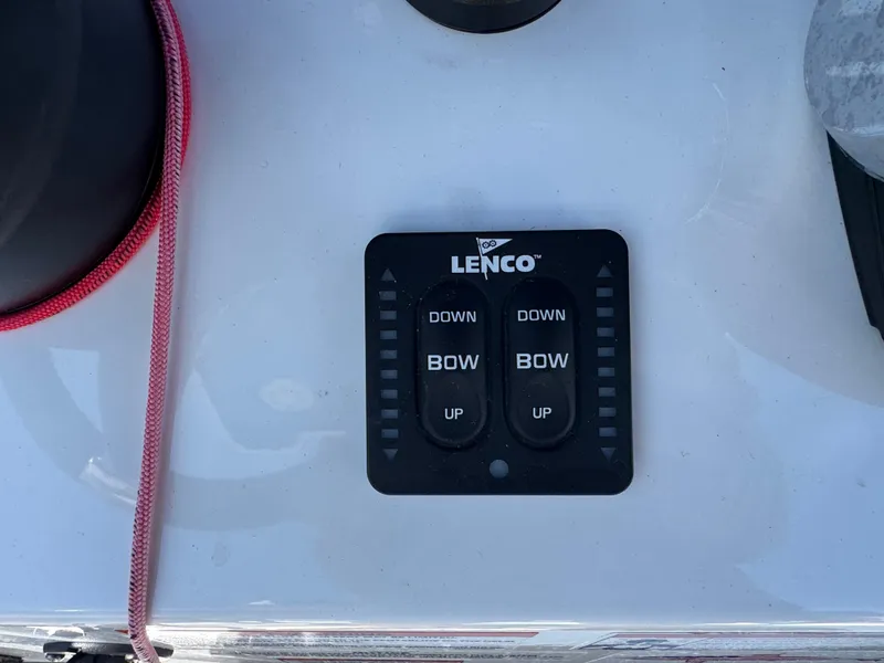 Slide: The Image of Lenco trim tab control panel on 2020 Blackfin 212 CC boat dashboard. - 23