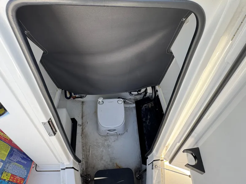 Slide: The Image of 2020 Blackfin 212 CC boat interior with compact marine toilet. - 31