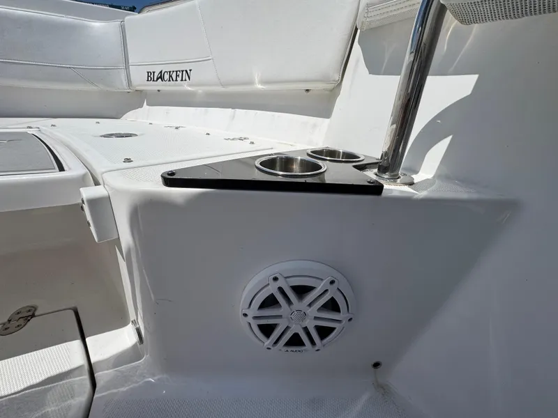 Slide: The Image of 2020 Blackfin 212 CC boat interior with cup holders and speaker. - 36