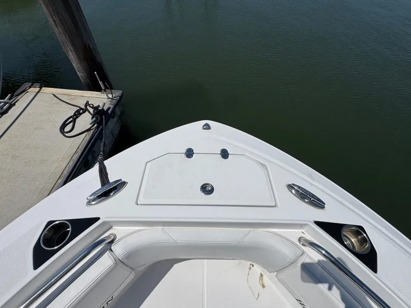 Slide: The Image of Bow view of 2020 Blackfin 212 CC boat docked by the water. - 37