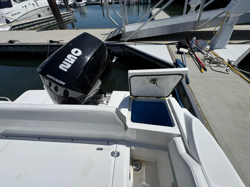 Slide: The Image of 2020 Blackfin 212 CC boat with Mercury outboard engine docked at marina. - 7