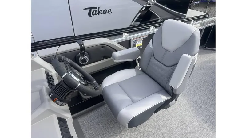 Slide: The Image of 2025 Tahoe Pontoon LTZ Cruise captain's chair and steering console. - 10