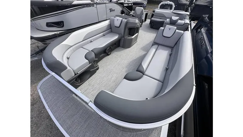 Slide: The Image of 2025 Tahoe Pontoon LTZ Cruise interior with gray seating and spacious layout. - 12