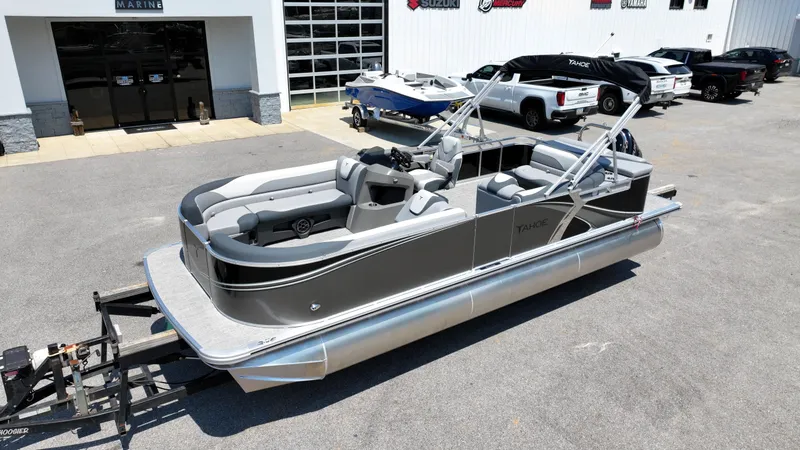 Slide: The Image of 2025 Tahoe Pontoon LTZ Cruise boat on trailer outside dealership. - 17