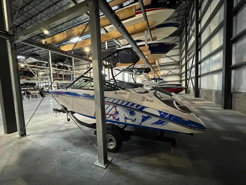 Slide: The Image of 2015 Yamaha AR192 boat stored indoors on a trailer in a warehouse. - 4