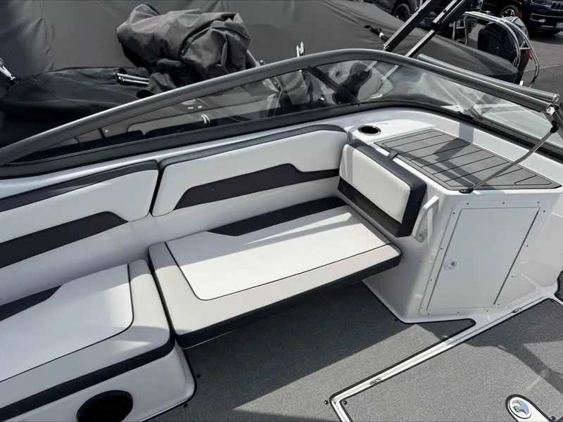 Slide: The Image of 2019 Yamaha AR195 boat interior with sleek seating and storage area. - 7