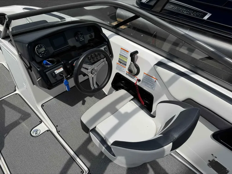 Slide: The Image of 2019 Yamaha Boats AR195 cockpit with steering wheel and control panel. - 8
