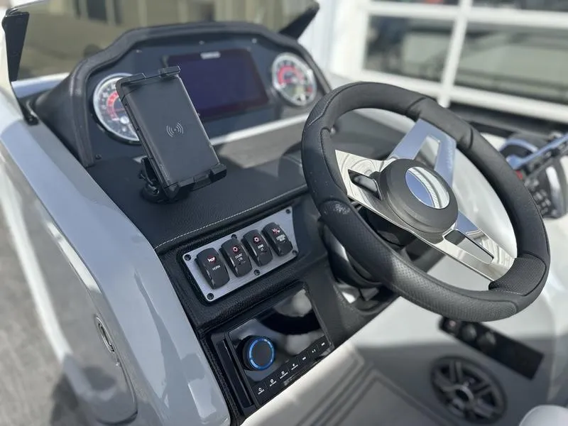 Slide: The Image of 2025 Godfrey Monaco 255 DFL iMPACT helm with modern controls and sleek steering wheel. - 10
