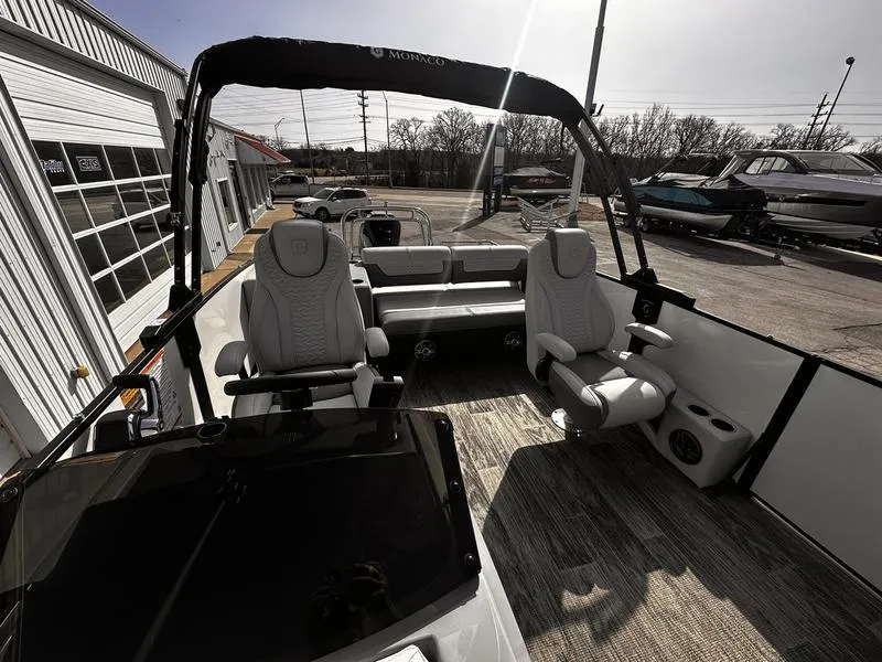 Slide: The Image of 2025 Godfrey Monaco 255 DFL iMPACT pontoon boat interior with luxurious seating and modern design. - 11