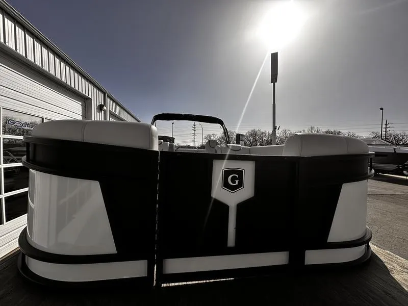Slide: The Image of 2025 Godfrey Monaco 255 DFL iMPACT pontoon boat in a sunny outdoor setting. - 14
