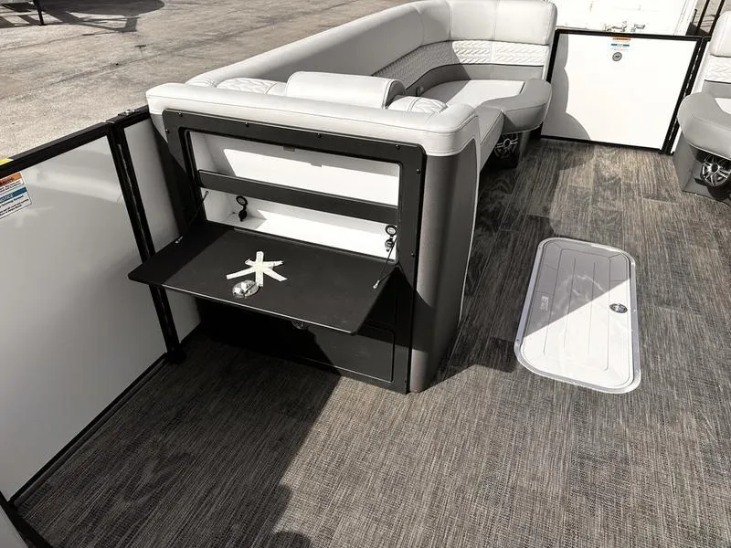 Slide: The Image of Luxurious 2025 Godfrey Monaco 255 DFL boat interior with seating and table. - 2