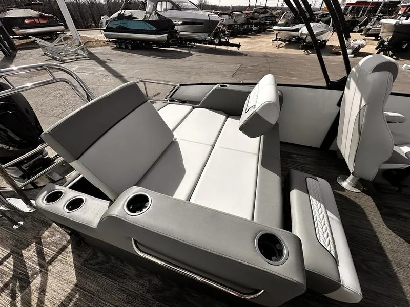 Slide: The Image of Luxurious seating on 2025 Godfrey Monaco 255 DFL iMPACT pontoon boat, featuring cup holders. - 3