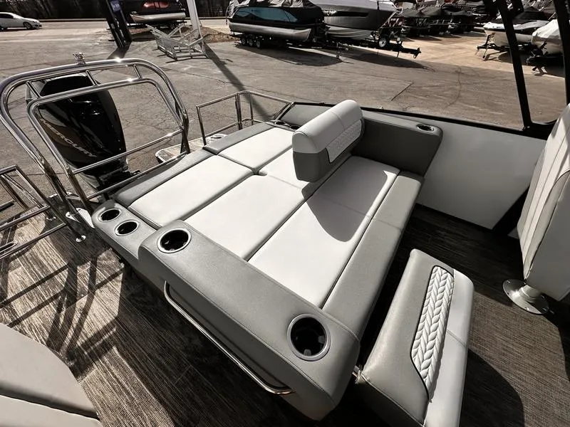 Slide: The Image of 2025 Godfrey Monaco 255 DFL boat interior with luxurious seating and cup holders. - 6