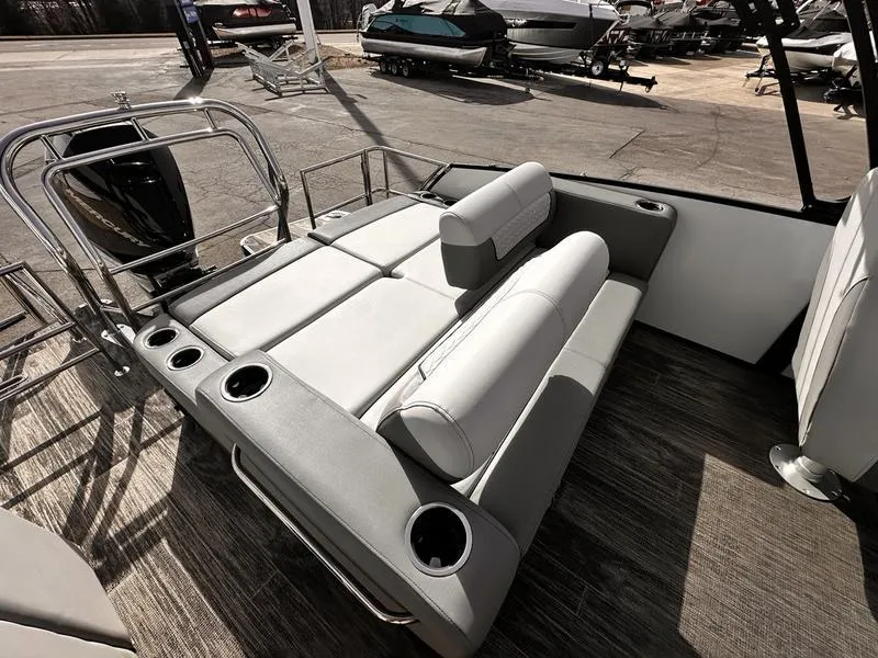 Slide: The Image of 2025 Godfrey Monaco 255 DFL iMPACT boat interior with plush seating and cup holders. - 7