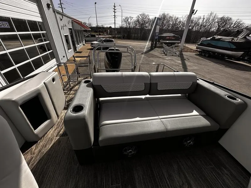 Slide: The Image of 2025 Godfrey Monaco 255 DFL iMPACT pontoon boat interior with seating and cup holders. - 9