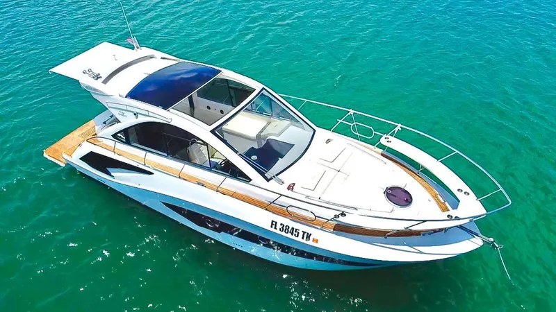 Slide: The Image of 2022 Evolve 400HT yacht on clear turquoise water, aerial view. - 0
