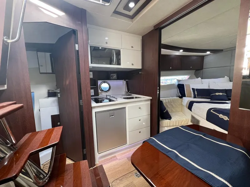 Slide: The Image of Luxurious interior of 2022 Evolve 400HT yacht with kitchen and cozy sleeping area. - 10