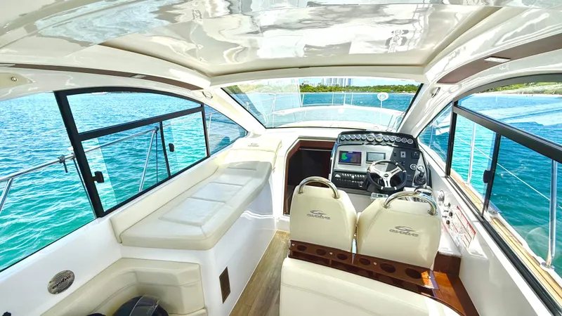 Slide: The Image of Luxurious interior of 2022 Evolve 400HT yacht with modern dashboard and seating. - 13