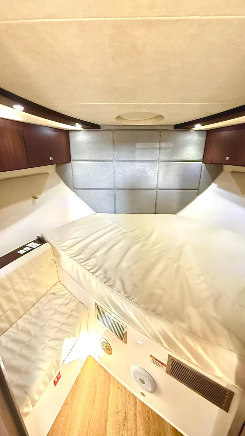 Slide: The Image of Interior of 2022 Evolve 400HT, featuring a cozy sleeping area with modern design elements. - 14