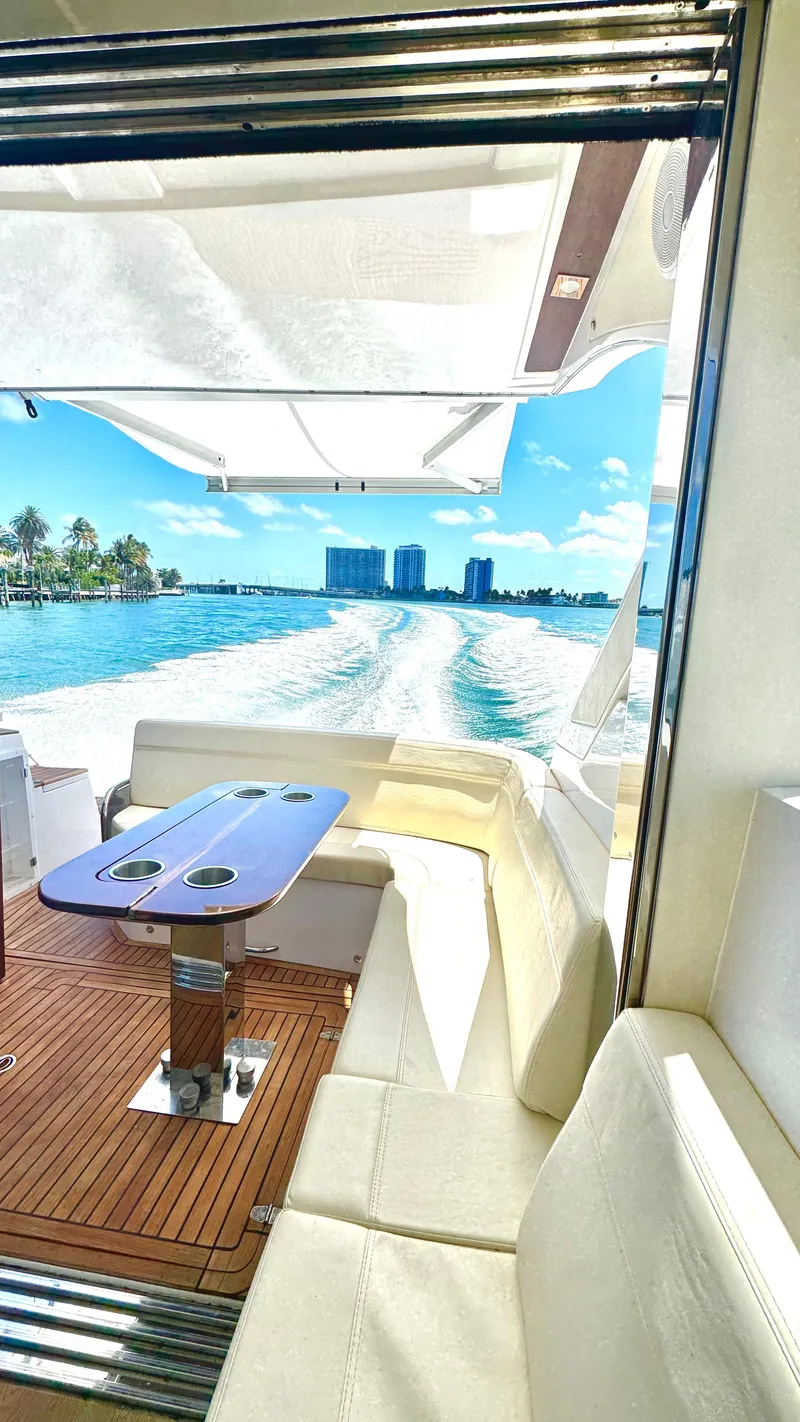 Slide: The Image of Luxurious 2022 Evolve 400HT yacht interior with ocean view and sleek seating area. - 19