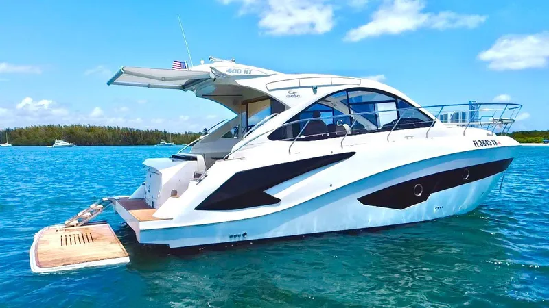 Slide: The Image of 2022 Evolve 400HT yacht on blue water under clear sky. - 2