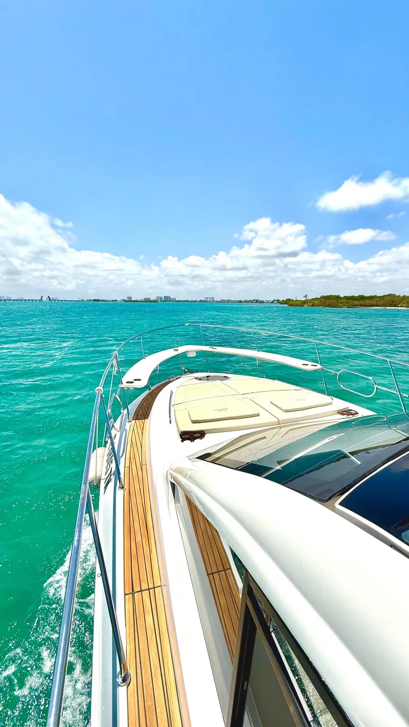 Slide: The Image of Evolve 400HT 2022 yacht cruising on turquoise waters under a clear blue sky. - 22