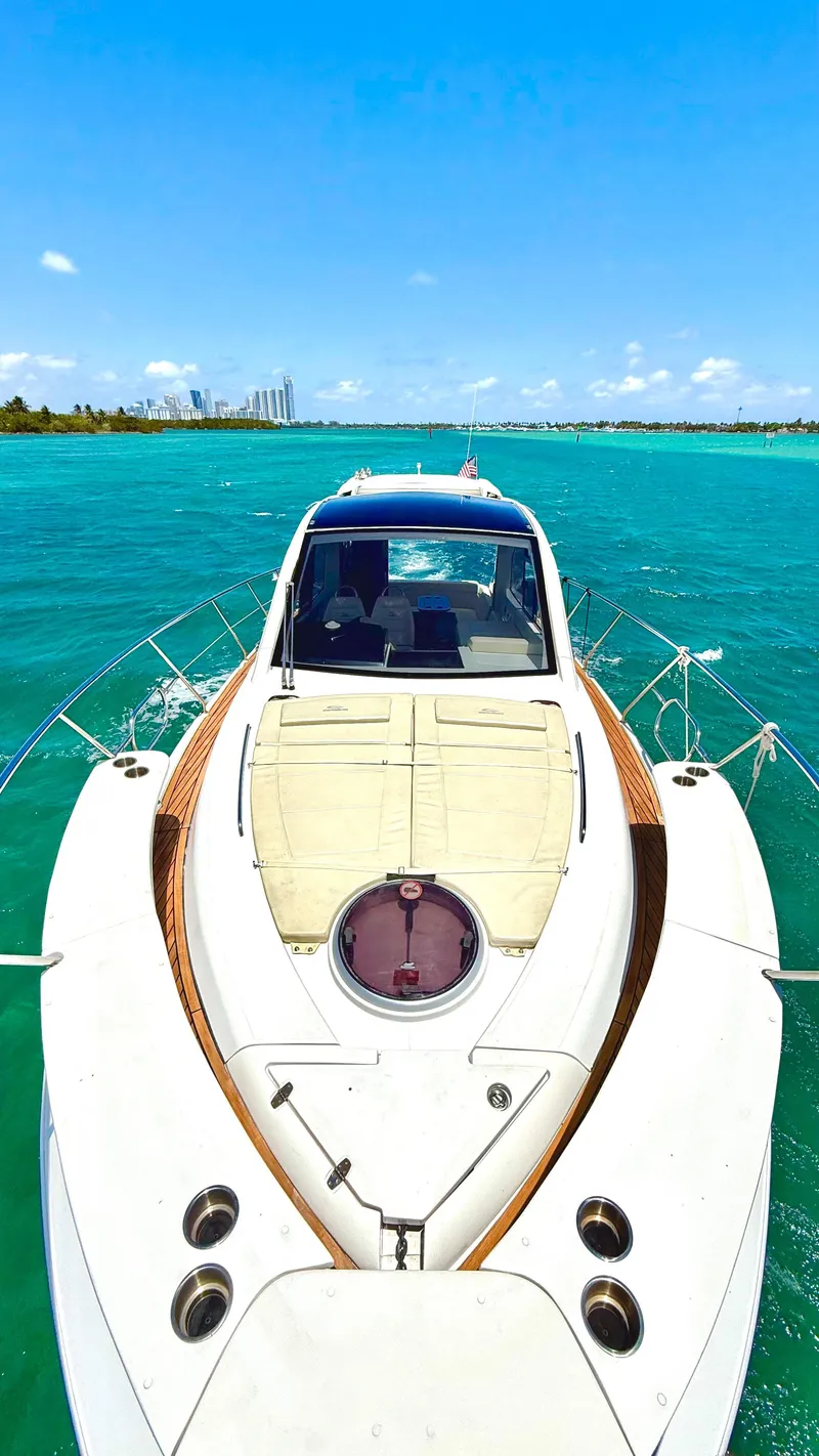 Slide: The Image of 2022 Evolve 400HT yacht cruising on turquoise waters under a clear blue sky. - 24