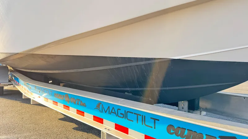 Slide: The Image of Evolve 400HT 2022 boat on Magic Tilt trailer, side view. - 29