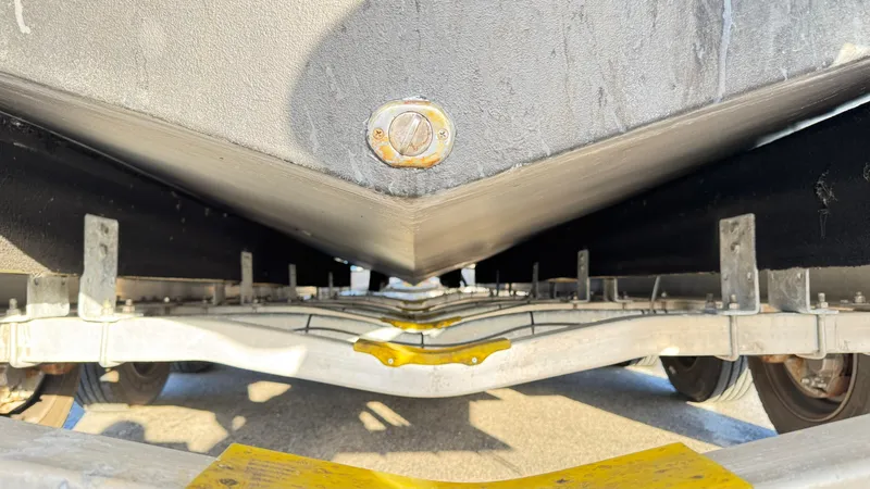 Slide: The Image of Underneath view of a 2022 Evolve 400HT boat on a trailer. - 30