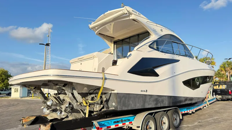 Slide: The Image of 2022 Evolve 400HT yacht on trailer under clear sky. - 32