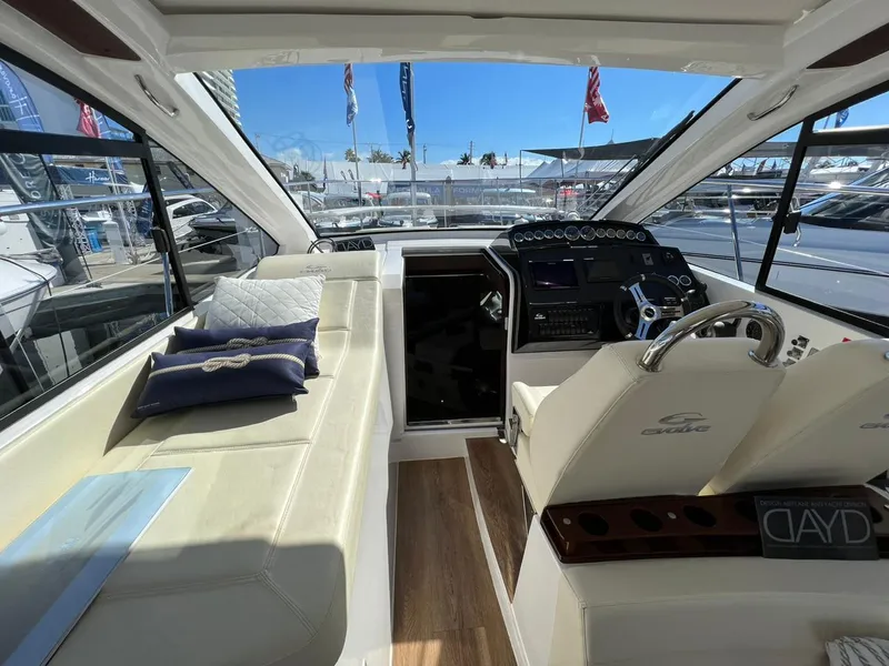 Slide: The Image of Interior of 2022 Evolve 400HT yacht with luxurious seating and modern helm. - 8