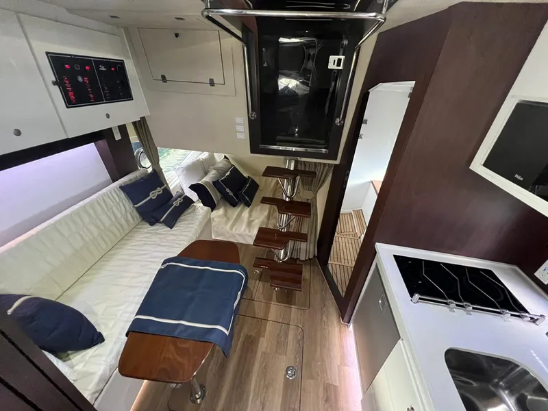 Slide: The Image of Interior of 2022 Evolve 400HT yacht with modern kitchen and seating area. - 9