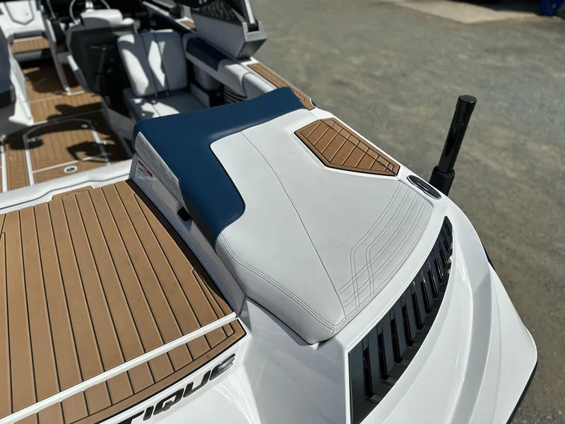 Slide: The Image of 2019 Nautique Super Air G23 boat interior with sleek seating and teak flooring. - 27