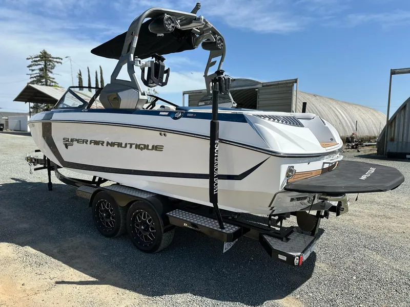 Slide: The Image of 2019 Nautique Super Air G23 boat on trailer, parked outdoors. - 4